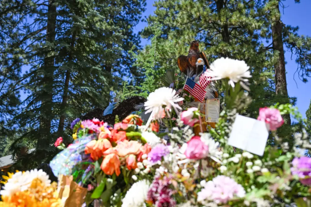 Flowers surround the memorial site for Jackie, the Big Bear...