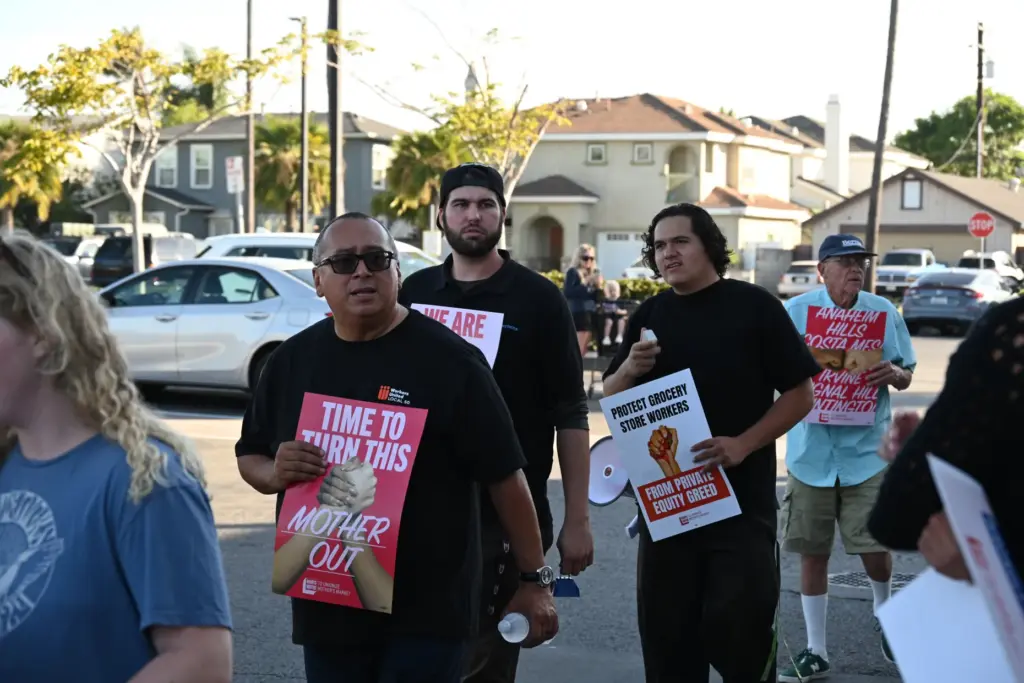 Above, on Monday, Aug. 24, workers with Mother’s Market &...