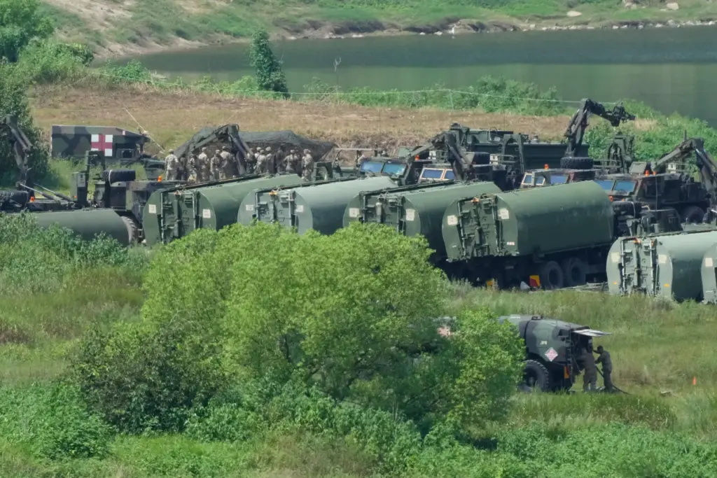 The U.S. Army’s armored vehicles gather to cross a river...