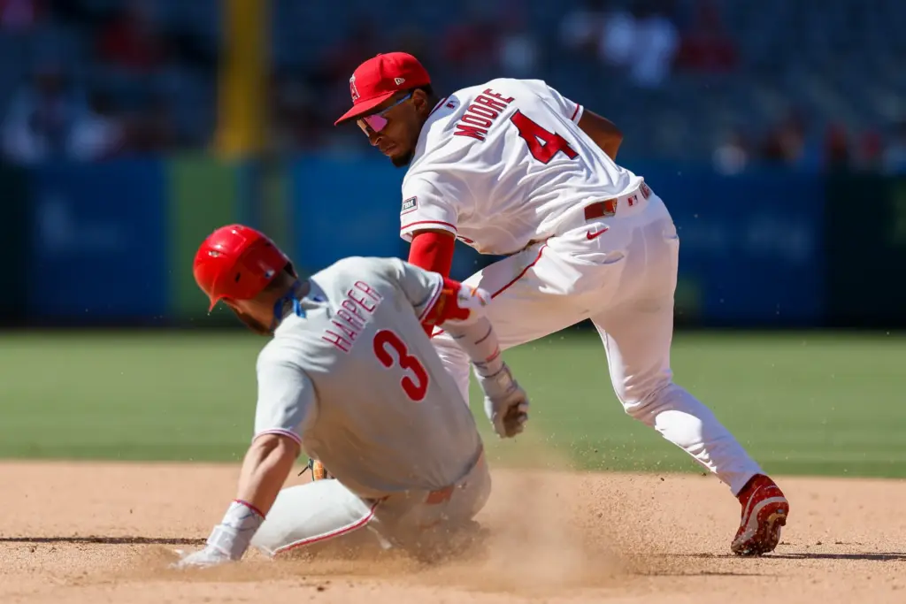 Philadelphia Phillies’ Bryce Harper (3) slides into second base as...
