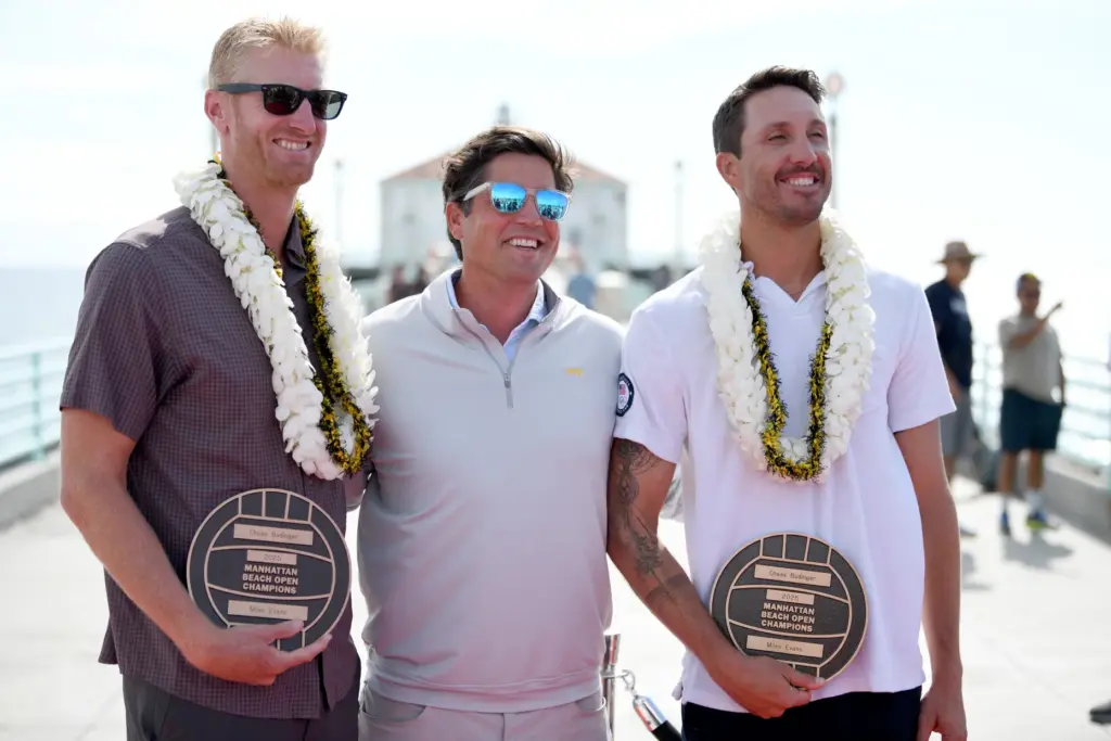 Chase Budinger and Miles Evans hold their plaques after the...