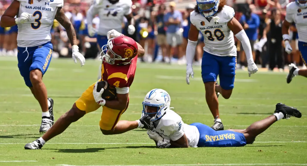 Wide receiver Trent Mosley (4) of the USC Trojans catches...