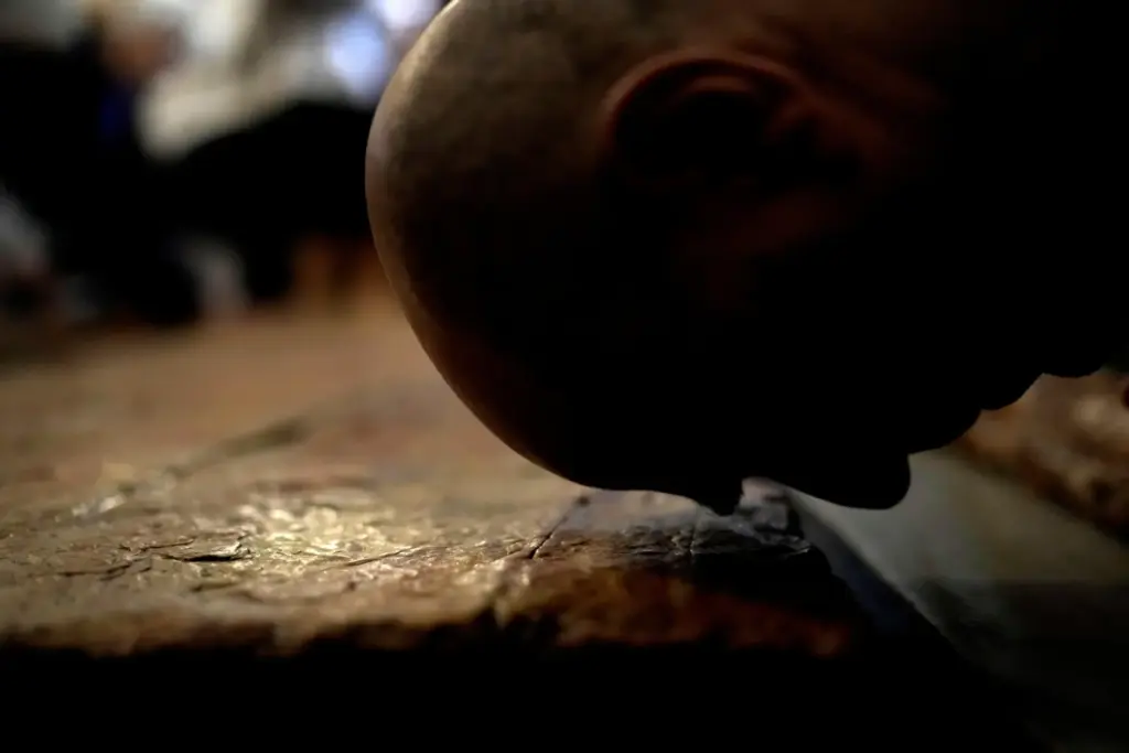 A Christian worshipper kisses the Stone of Unction.
