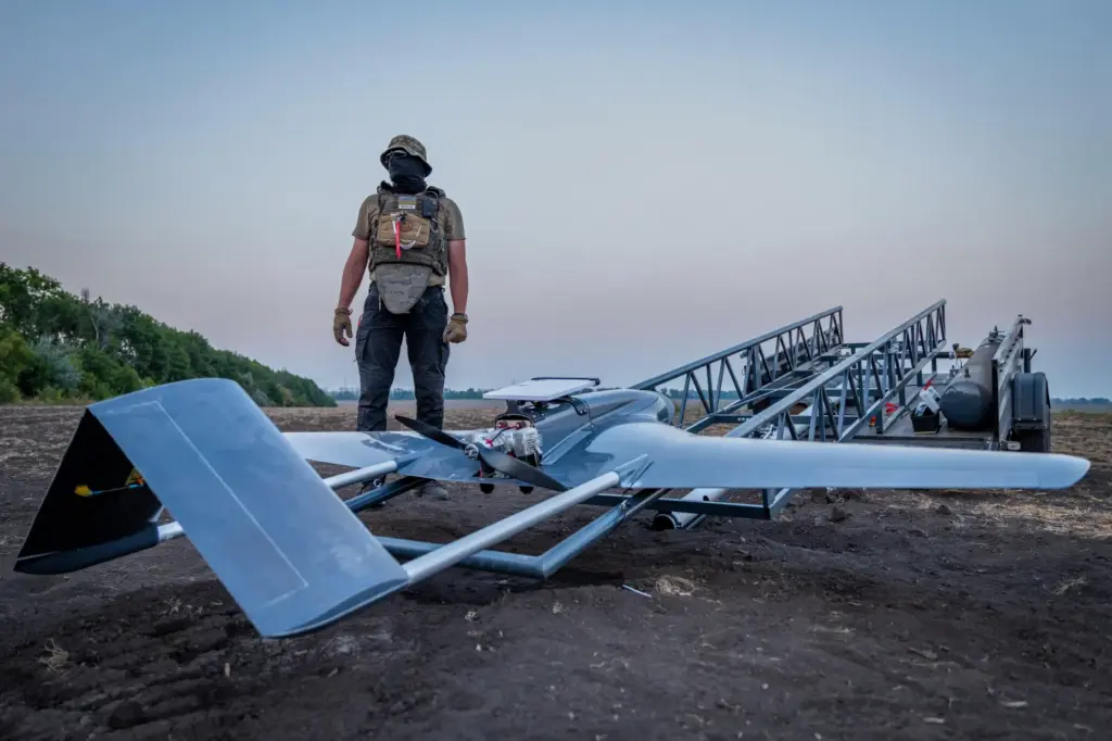A Ukrainian serviceman prepares a “Chaklun” strike drone used for...