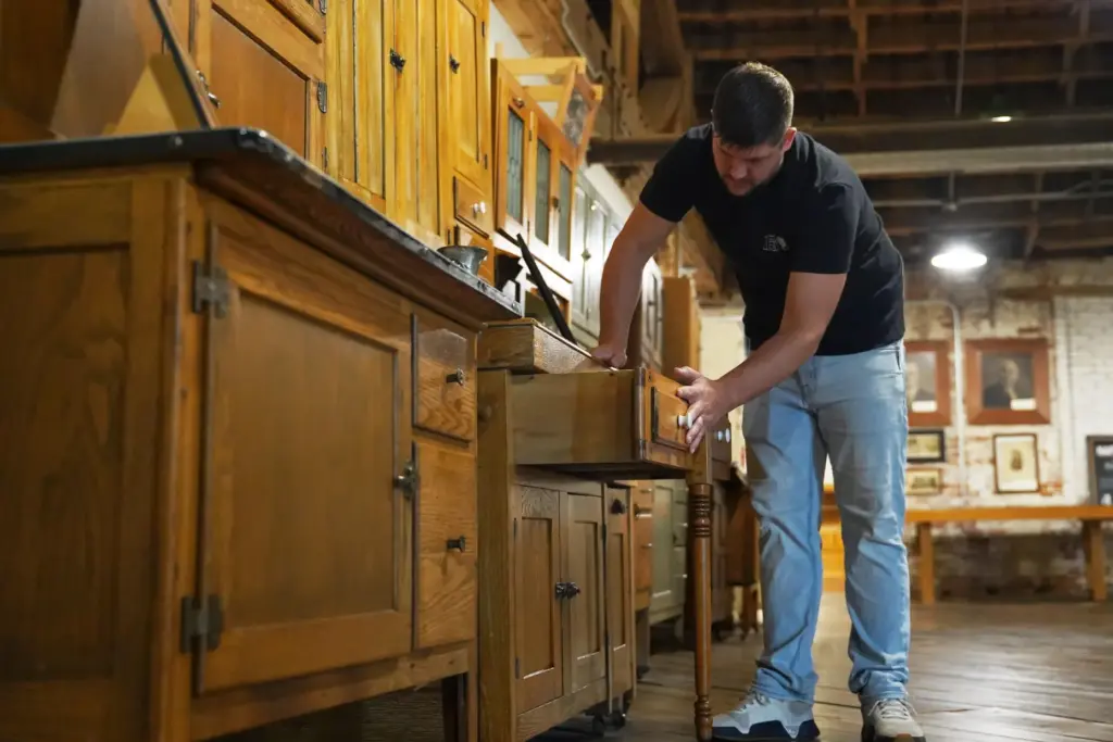 Wesley Mast shows various models of Hoosier cabinets.