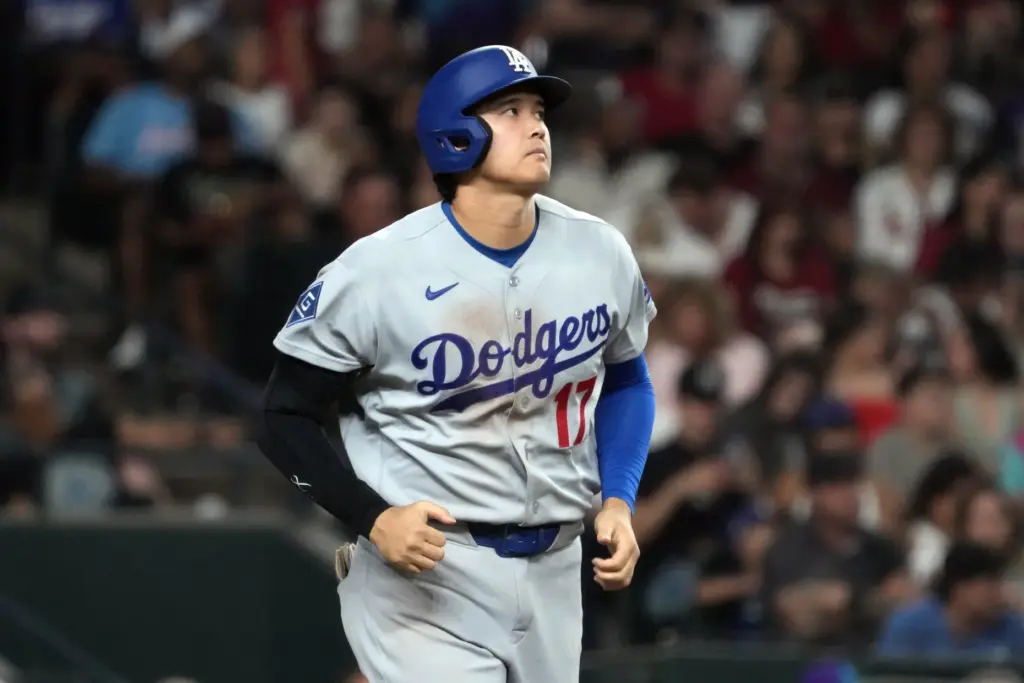 Dodgers star Shohei Ohtani looks on after batting during a...