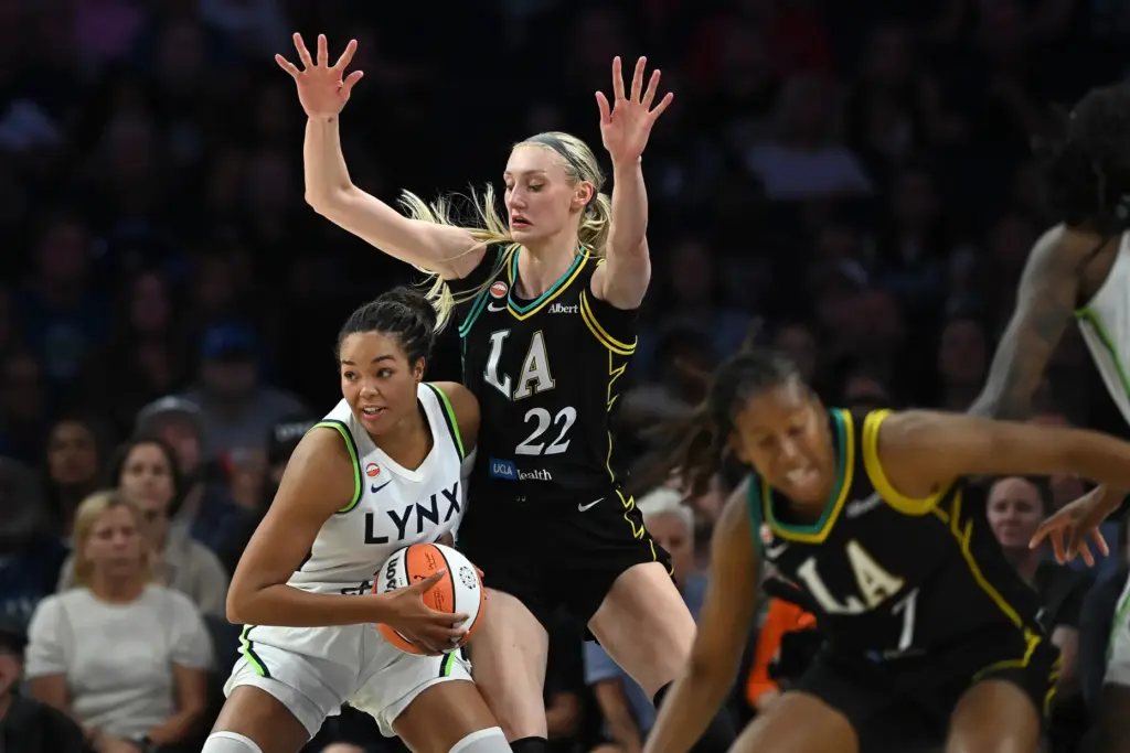 Minnesota Lynx forward Napheesa Collier holds the ball as Sparks...