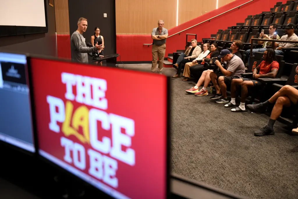 Coach Lincoln Riley talks to the media as part of...