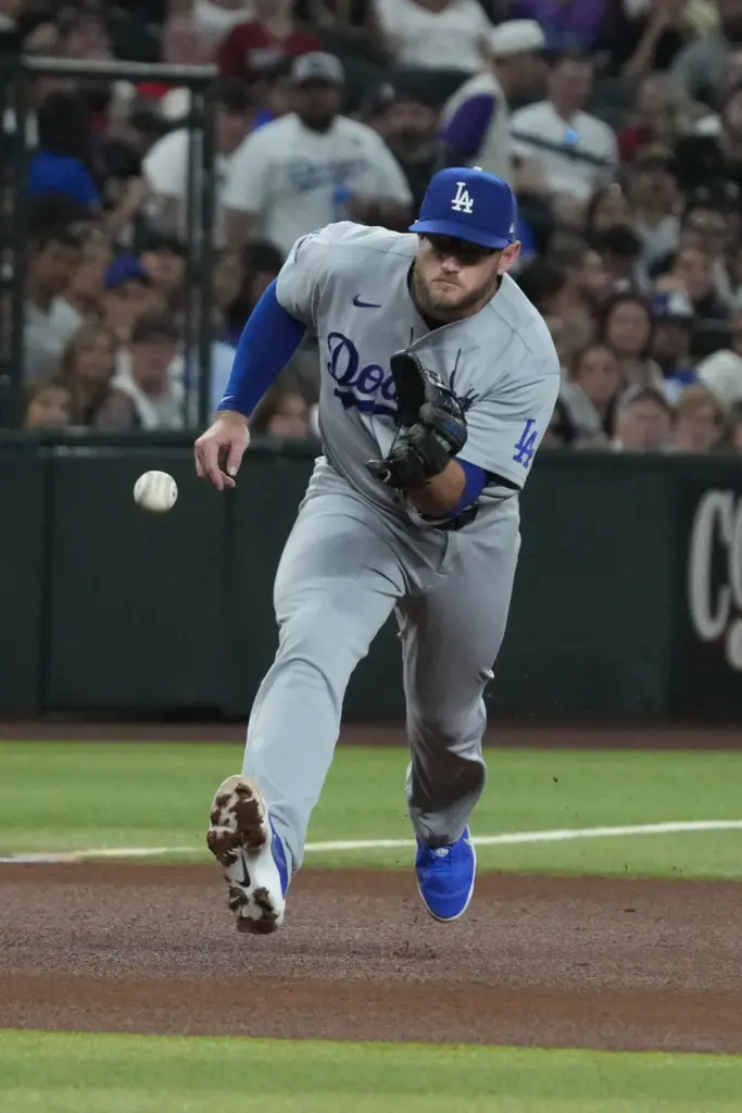 Dodgers third baseman Max Muncy fields a ball during a...
