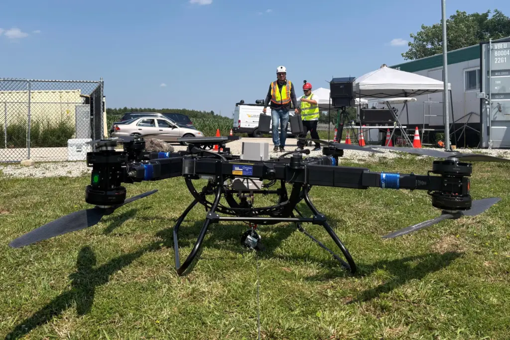 Volatus Aerospace workers prepare a heavy lift drone for testing.