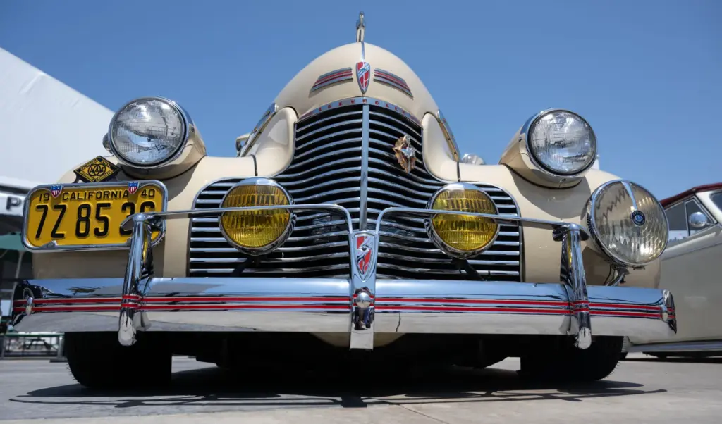 Classic lowrider cars add to the 1940s-era ambience during a...