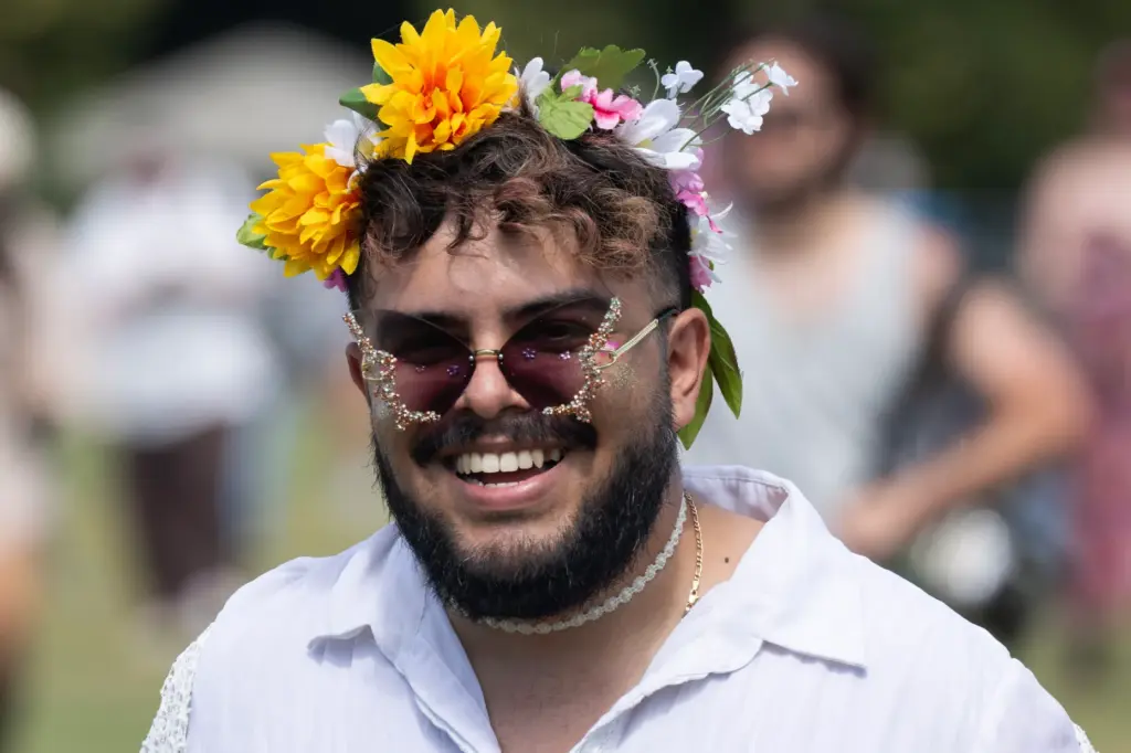 A festivalgoer wears a flower crown during the Daisy Chain...