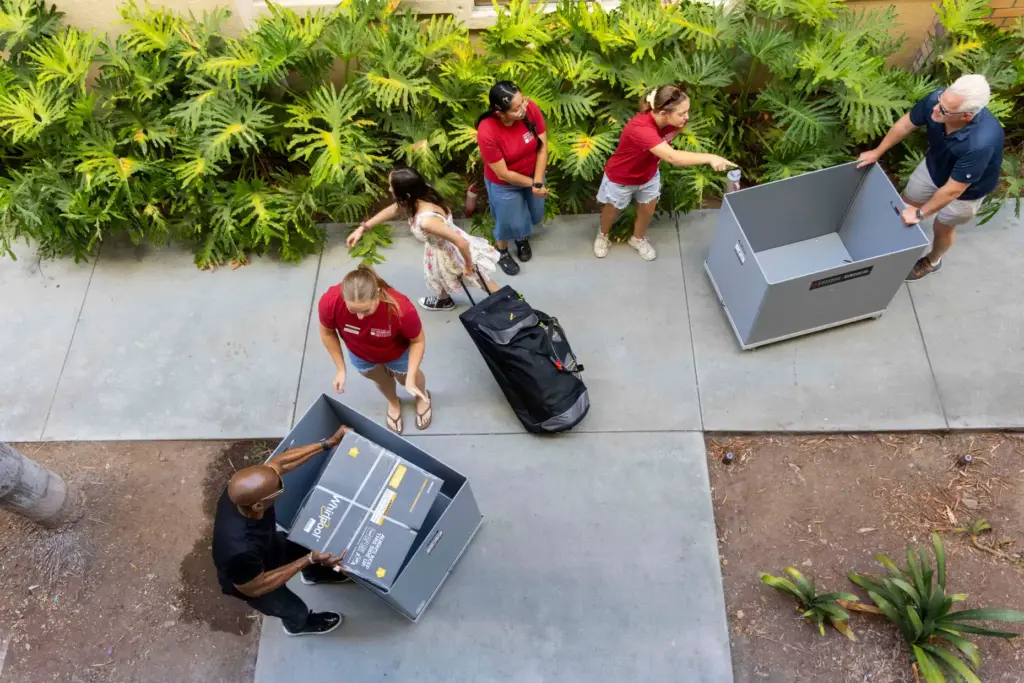 Resident Advisors Grace Cummins, Erika Ramos and Ainsley Manus help...