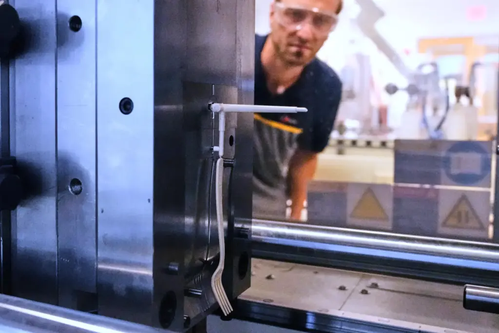 Peter Steeves, a polymer engineer at CJ Biomaterials, watches a...