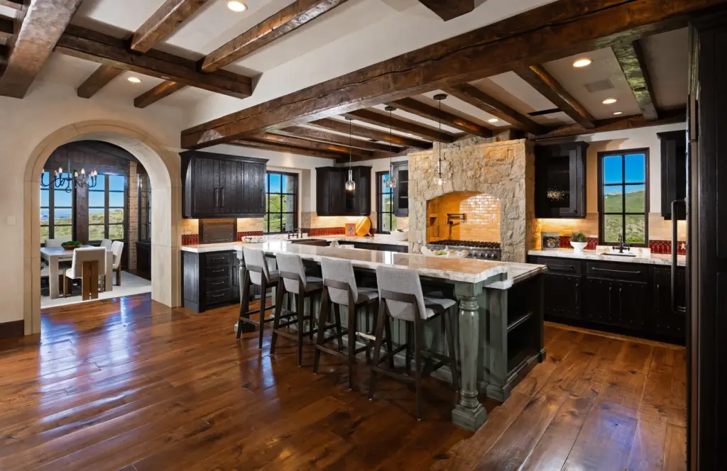 The kitchen connects to a breakfast nook through an archway....