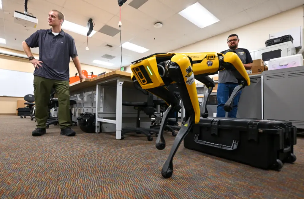 Matthew Alayoubi, right, controls a robotic drone with Nicholas Stafford...