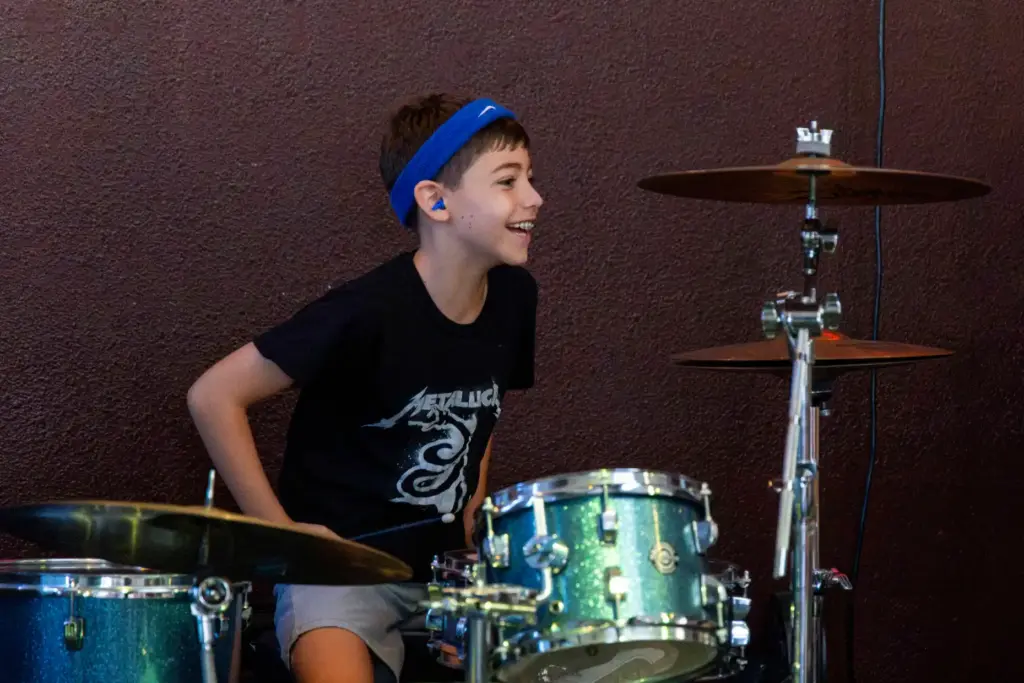 Wesley Johnson, 10, smiles as the audience applauds after his...