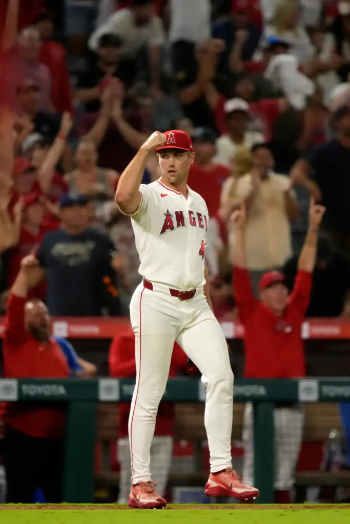 Angels relief pitcher Ben Joyce celebrates after right fielder Wade...