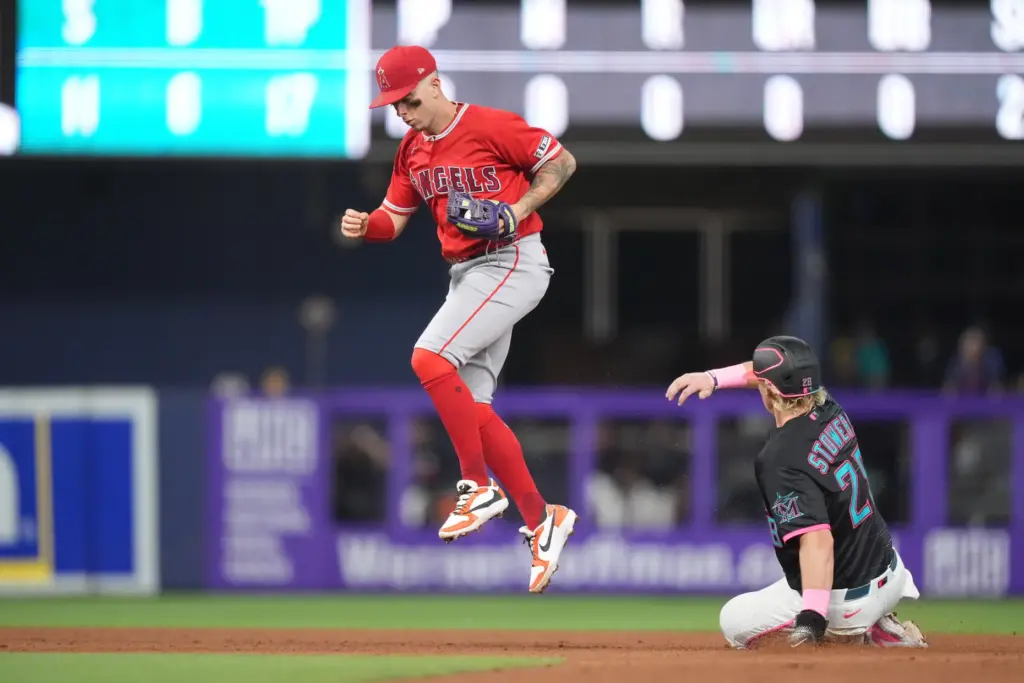 Angels shortstop Zach Neto jumps after forcing out the Miami...