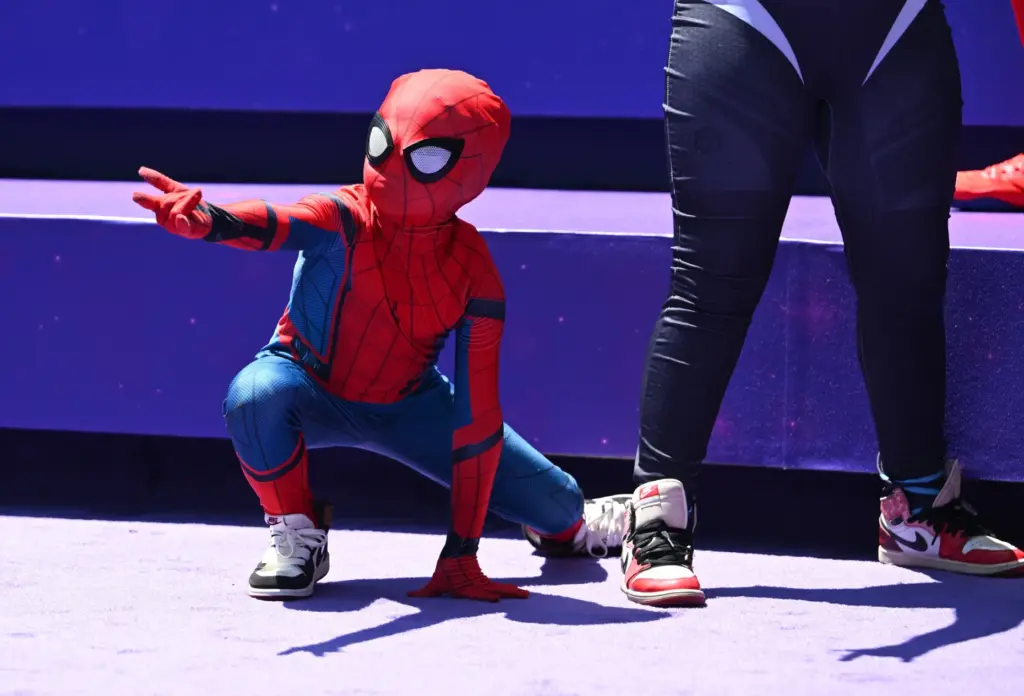 Daniel Delgado, 6, pretends to spin a web at a...