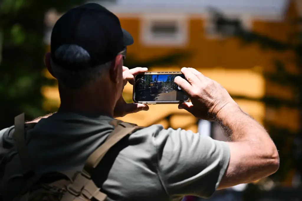 Vistors take photos of the memorial for Jackie, the Big...