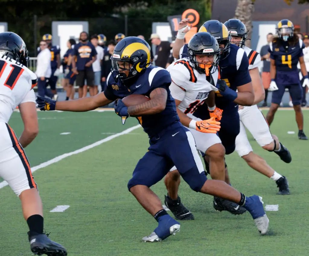 Milliikans Ryan Carter gets through Huntington Beachs defense in Long...