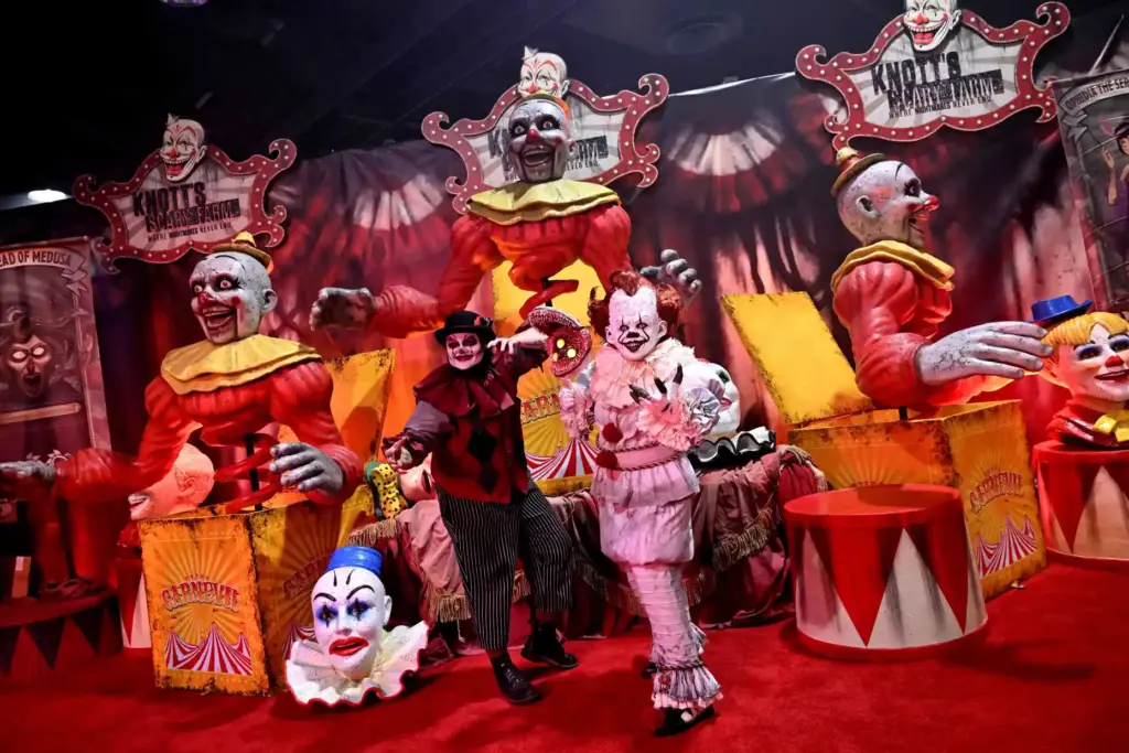 Fans pose in front of scary clowns during the Midsummer...