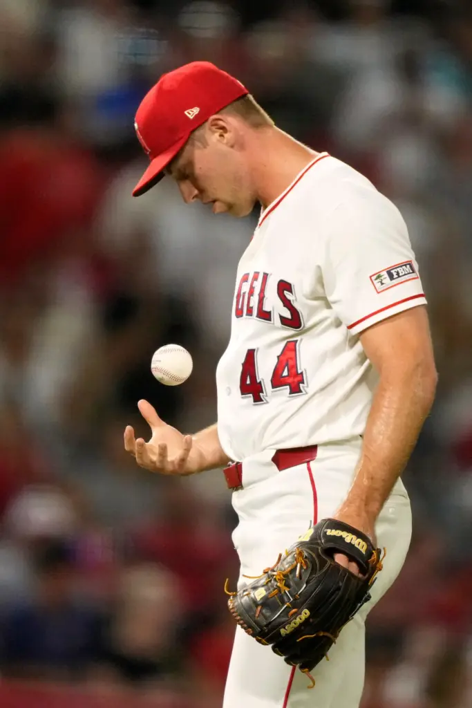 Angels relief pitcher Ben Joyce tosses the ball after loading...