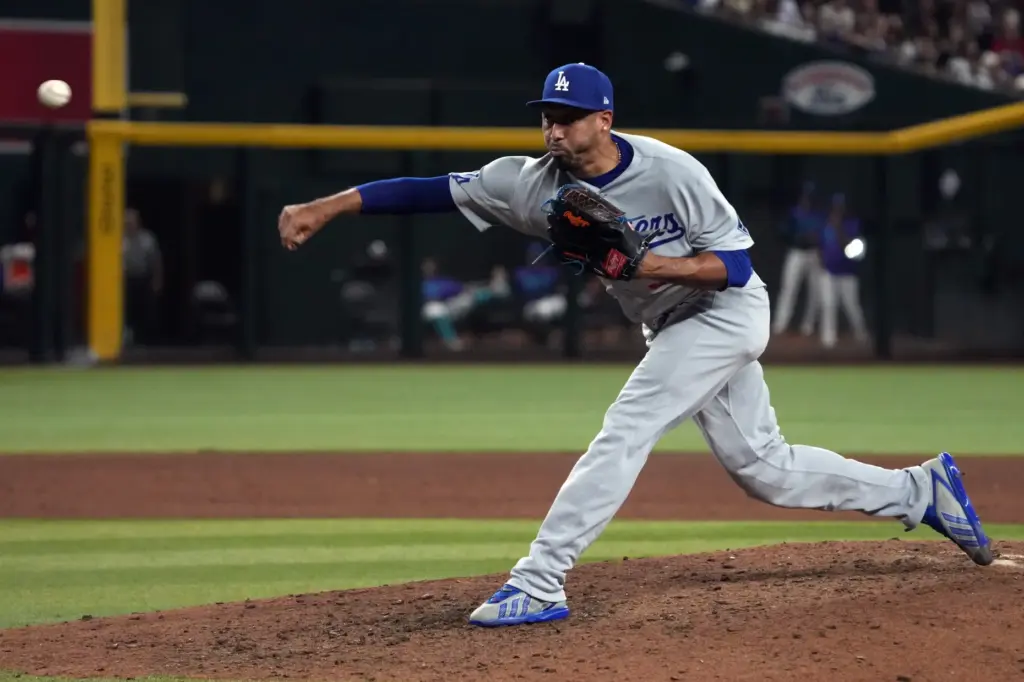 Dodgers relief pitcher Edwin DÃ­az throws to the plate Dodgers...