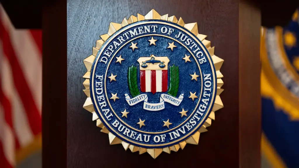 FILE – An FBI seal is displayed on a podium...
