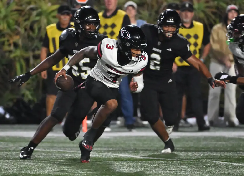 Centennial quarterback Jaden Jefferson (3) runs with the ball as...