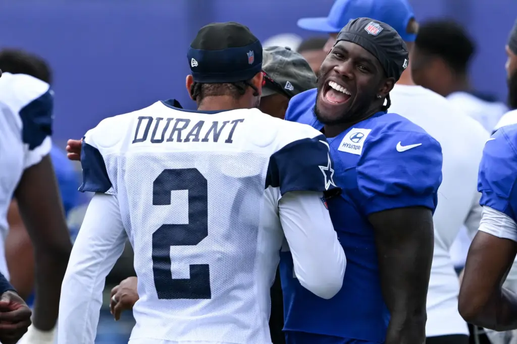 Rams wide receiver Mario Williams, right, and Dallas Cowboys defensive...