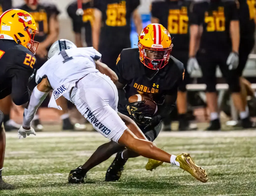 Mission Viejo defensive back Jordan Hicks, right, intercepts a pass...
