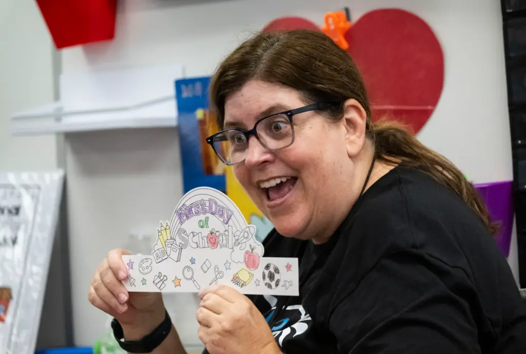 Transitional kendergarten teacher Lori West shows her students the project...
