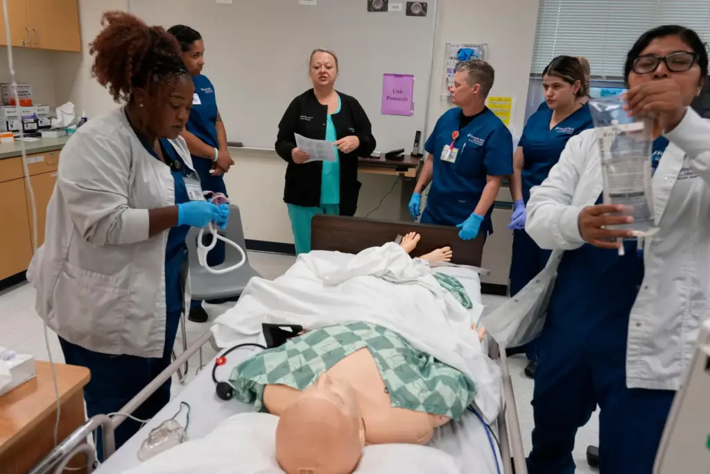 Instructor Renee McFatridge directs nursing students in the simulation lab.