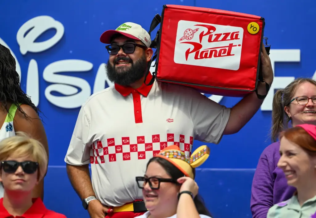 Daniel Rodriguez, dressed as a Pizza Planet delivery guy, at...