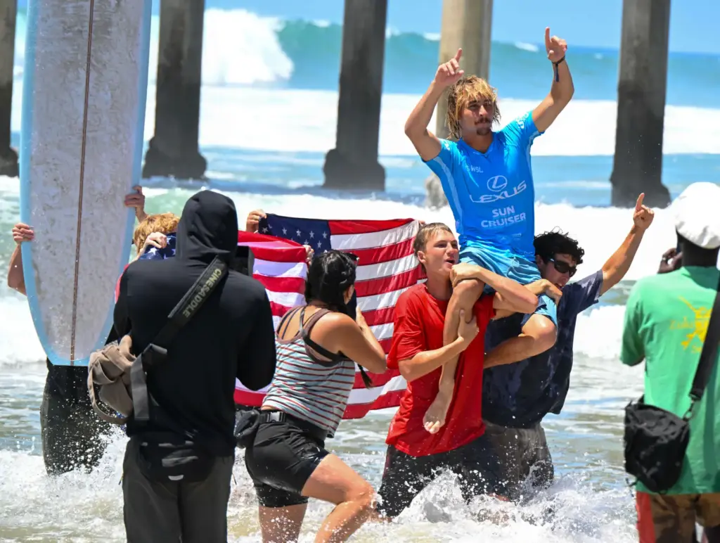 Tommy Coleman celebrates after winning the U.S. Open of Surfing...