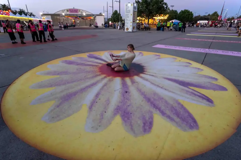 Holly Evans of Anaheim sits in the middle of a...