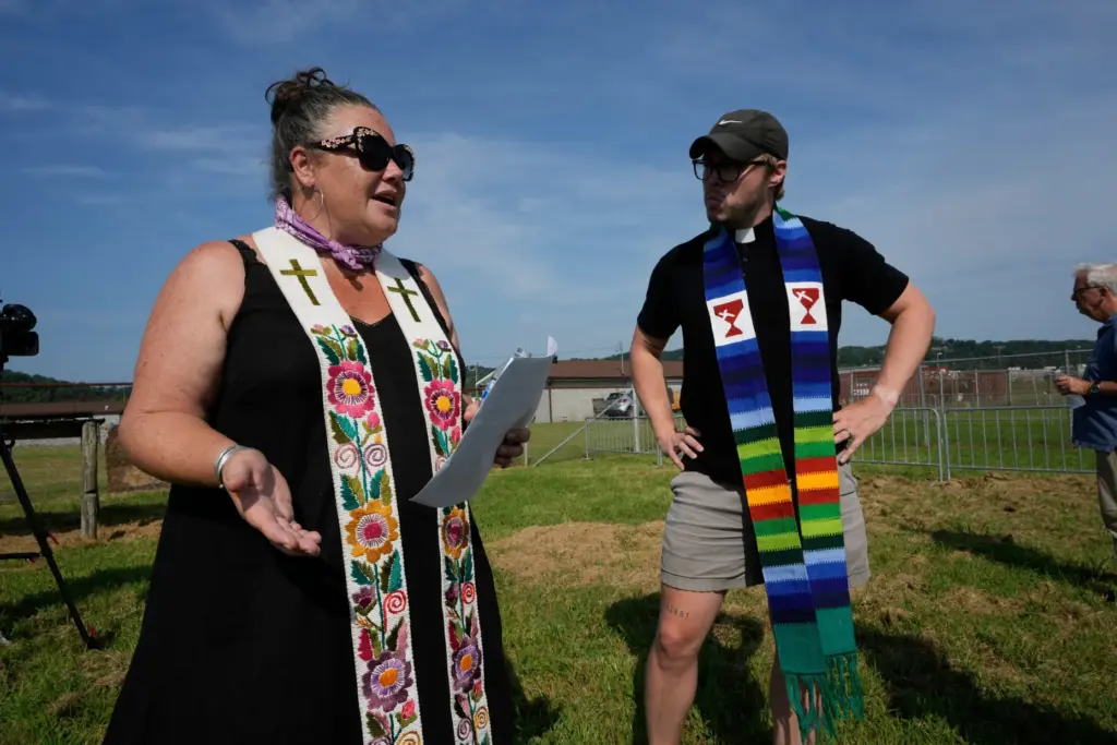 Pastor Ingrid McIntyre and Pastor Wesley King talk outside Riverbend Maximum Security Institution.