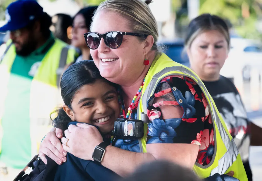 Miranda Godoy gives a hug to her former teacher Tania...