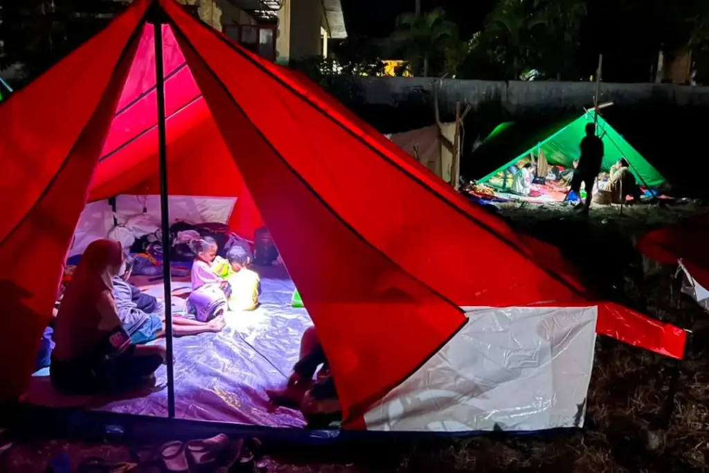 Earthquake survivors take shelter in tents in Reo, East Nusa Tenggara province, Indonesia.