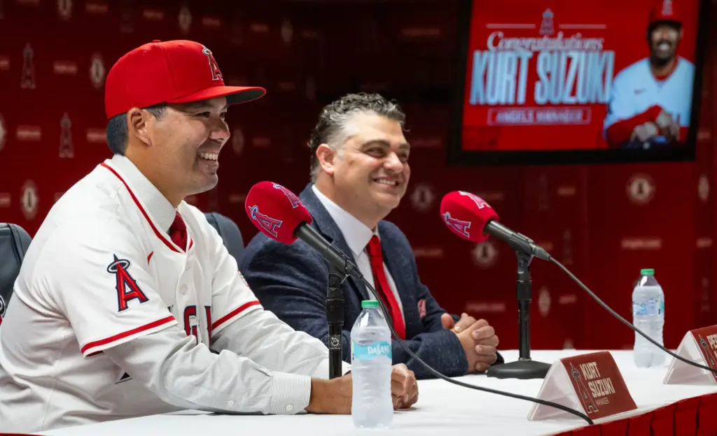 Kurt Suzuki, left, speaks after being announced as the new...
