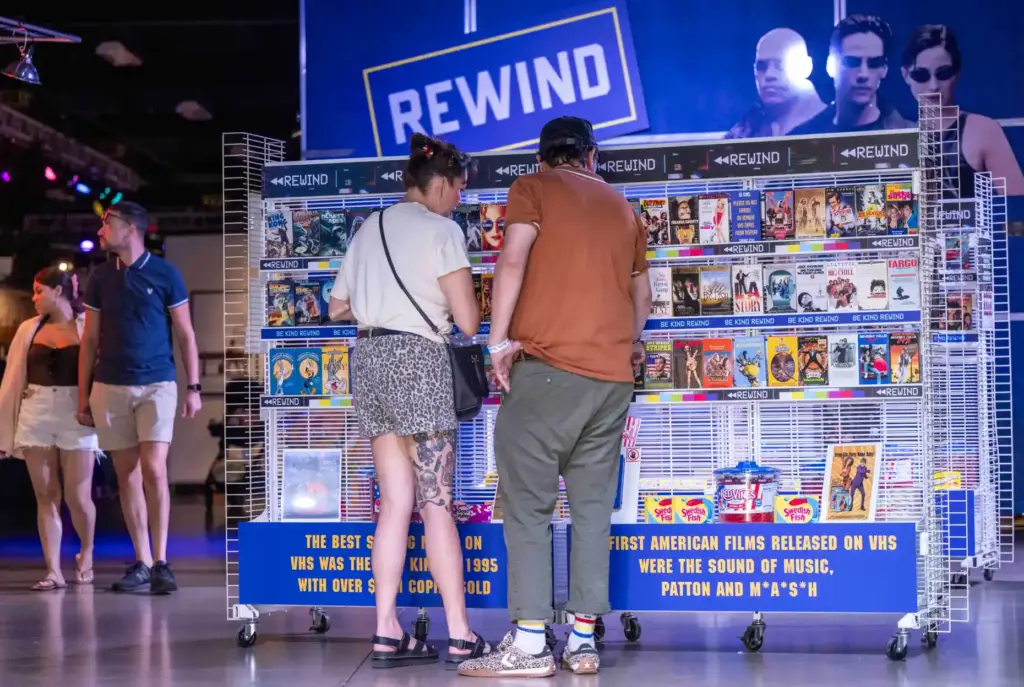 Fairgoers check out Rewind: A VHS Comeback exhibit at the...