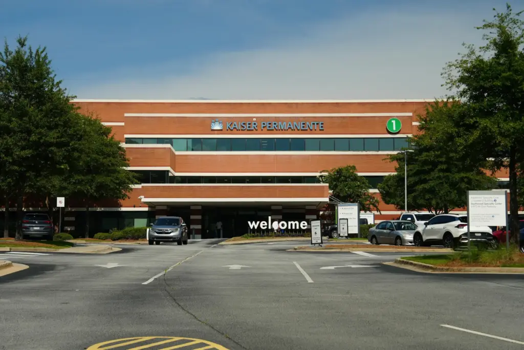 Signs mark the exterior of Kaiser Permanente medical center in...