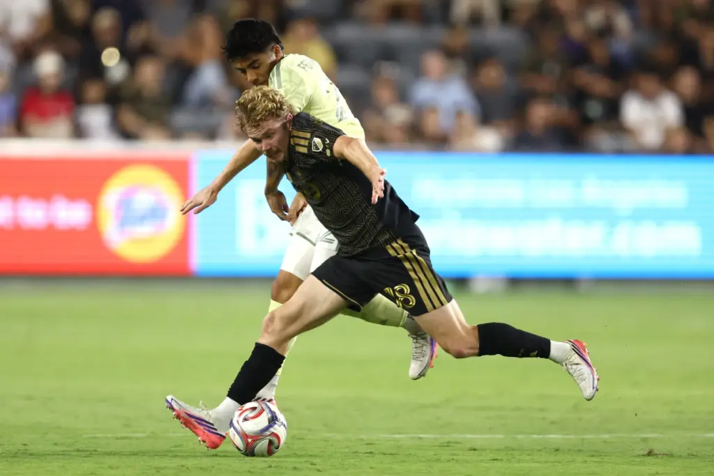 Los Angeles FC forward Jacob Shaffelburg, front, battles for the...