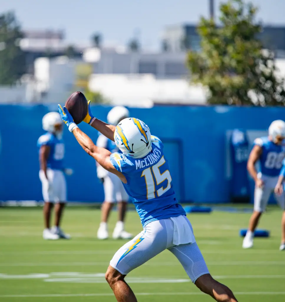 Los Angeles Chargers wide receiver Ladd McConkey extends both arms...