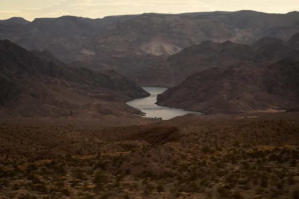 FILE – Water flows down the Colorado River downriver from...