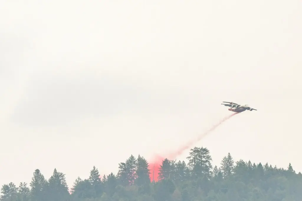 A plane drops fire retardant on the Plaskett Fire near Big Sur, California.