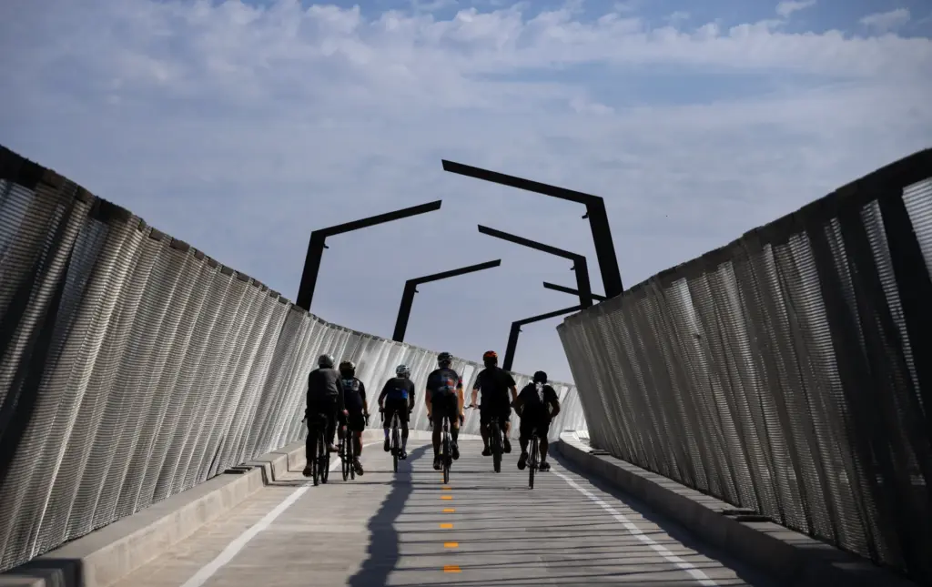 Bicyclists lead the way over the Jeffrey Open Space Trail...