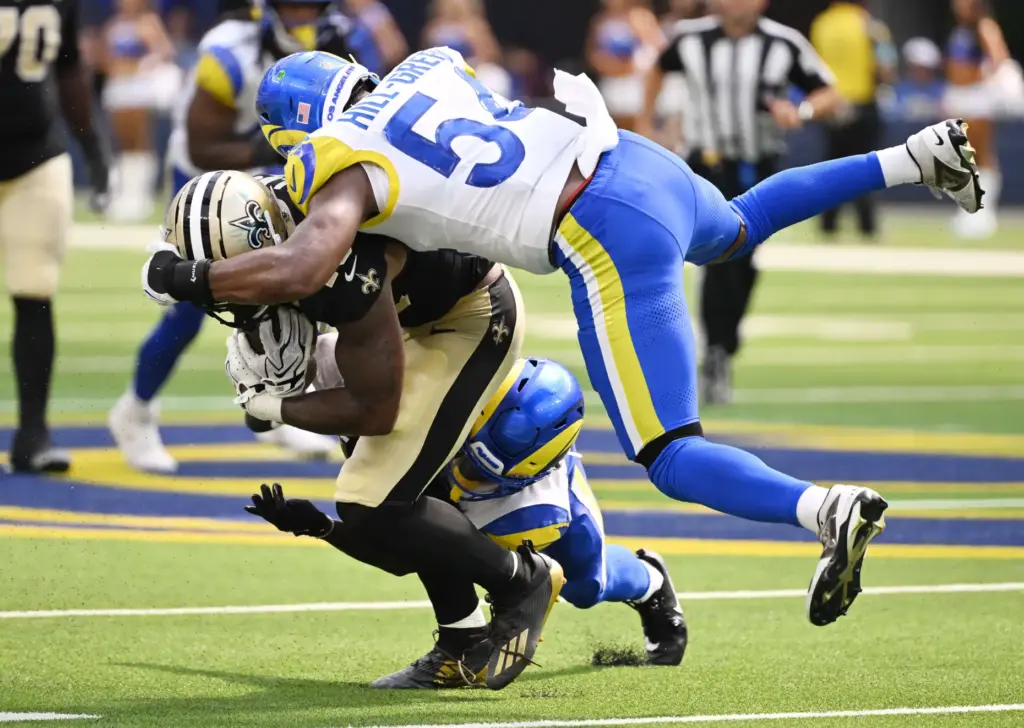 Rams linebacker Nikhai Hill-Green (54) tackles New Orleans Saints running...